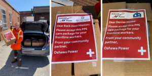 Janet Taylor loading donation boxes in car