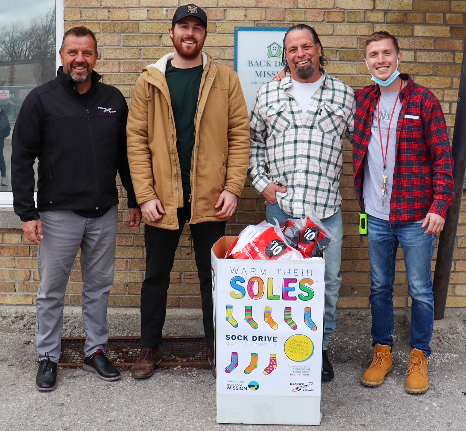 Oshawa Power Donates More Than 350 Pairs of Socks to Back Door Mission