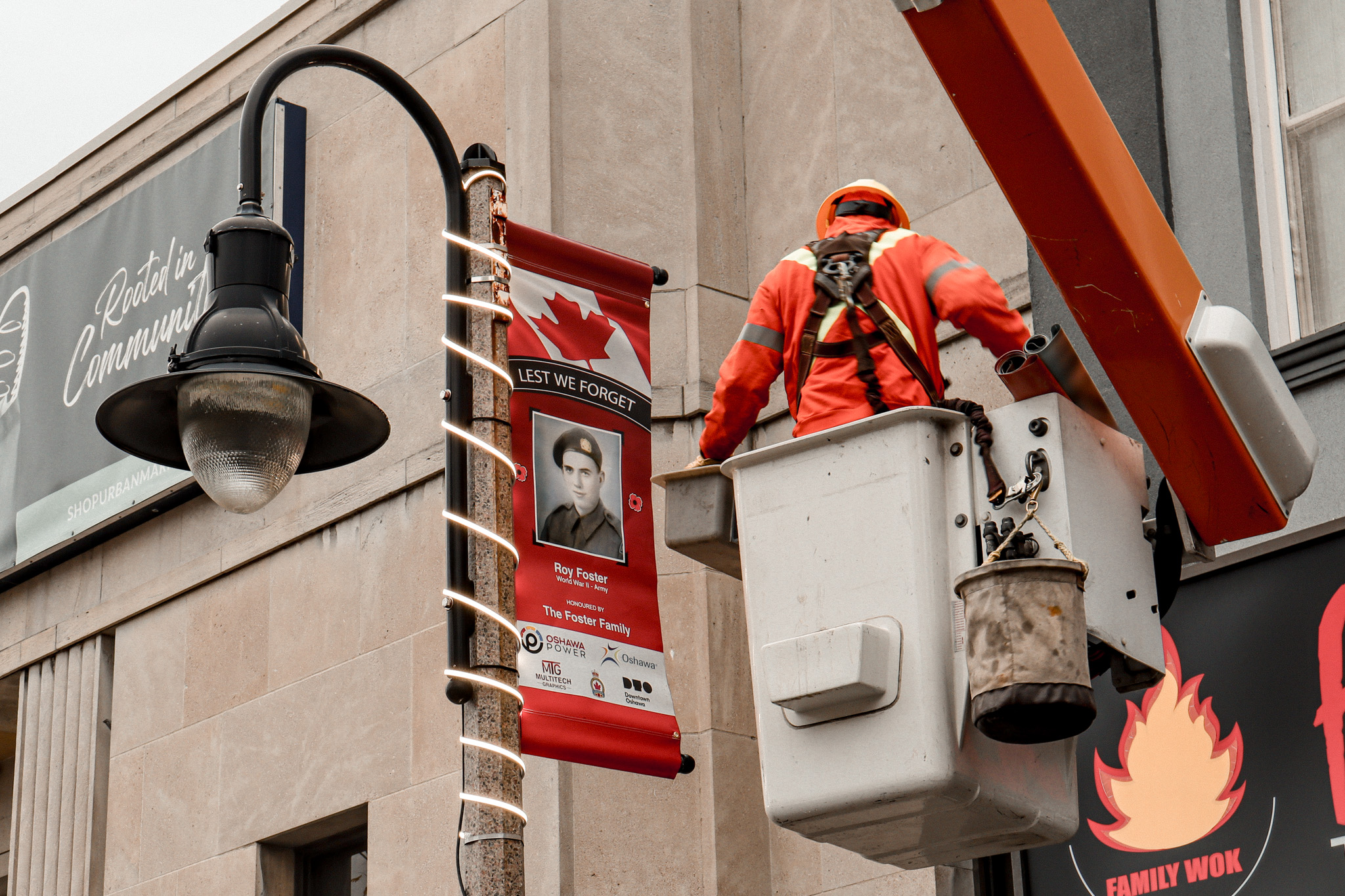 Oshawa Power crews raising banners to honour local veterans